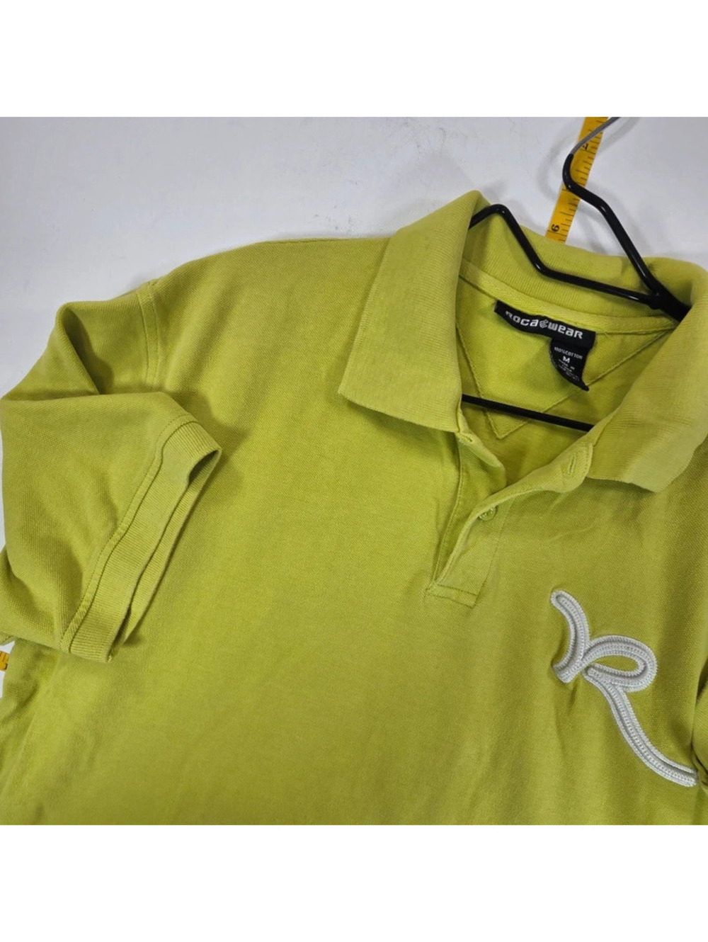 Rocawear polo shirt featuring an embroidered white "R" logo